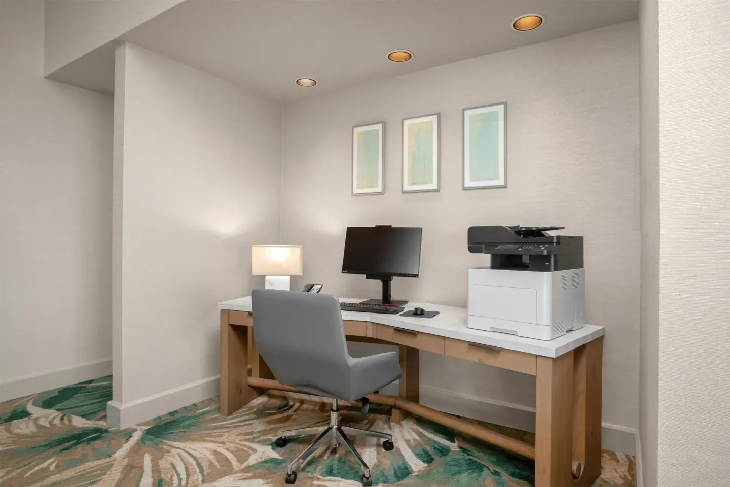 Guest room work desk with computer and printer at Hyatt Regency Maui Resort & Spa.