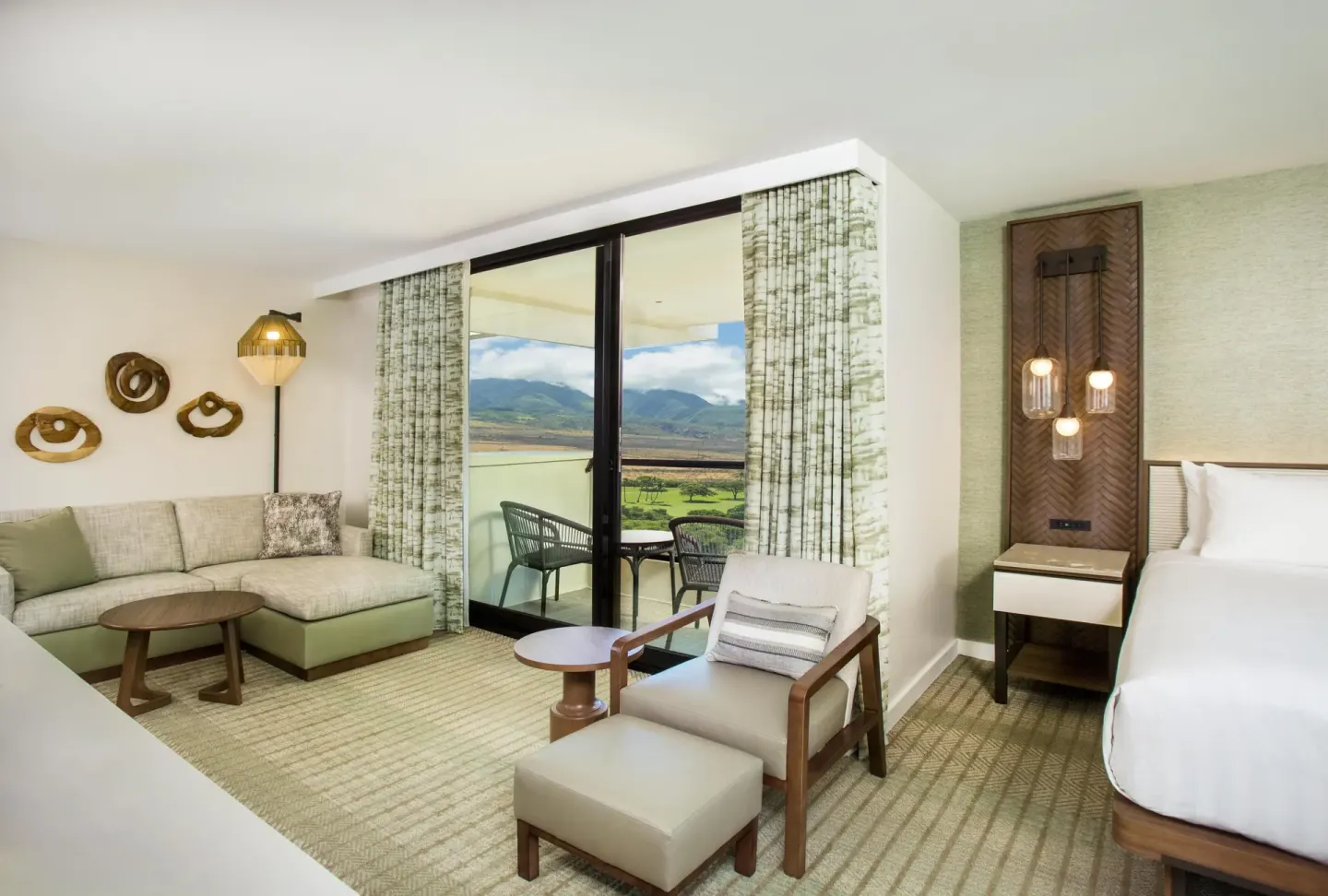 King guest room with sofa, balcony, and mountain view at Hyatt Regency Maui Resort & Spa.