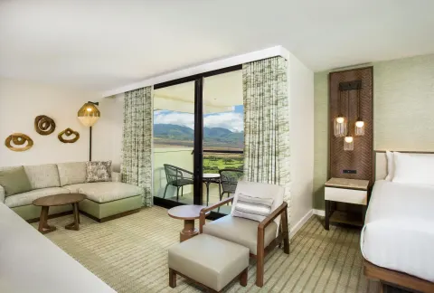 King guest room with sofa, balcony, and mountain view at Hyatt Regency Maui Resort & Spa.
