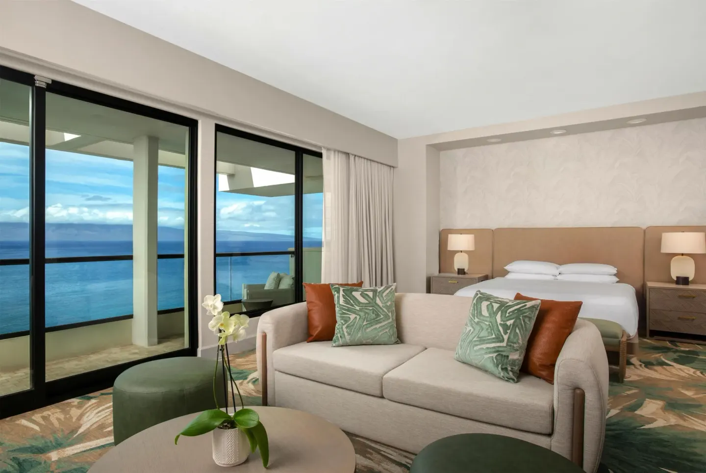 Oceanfront suite with king bed and sofa at Hyatt Regency Maui Resort & Spa.