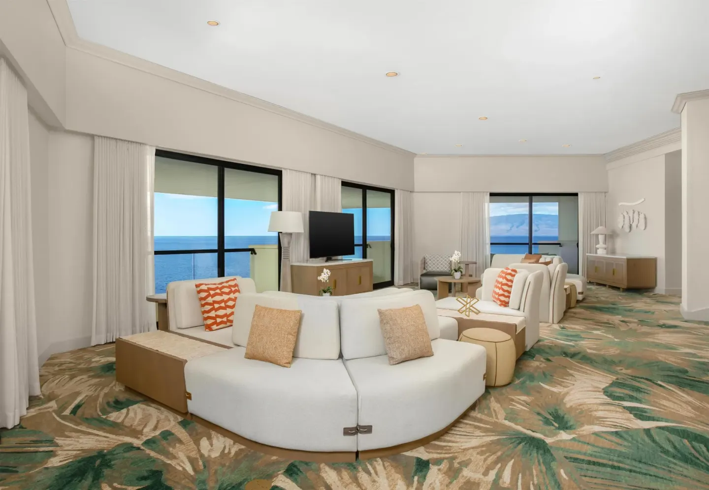 Oceanfront suite lounge with balcony windows at Hyatt Regency Maui Resort & Spa.