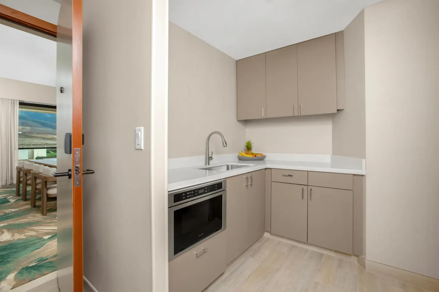 In-room kitchenette with sink, microwave and cabinets at Hyatt Regency Maui Resort & Spa.