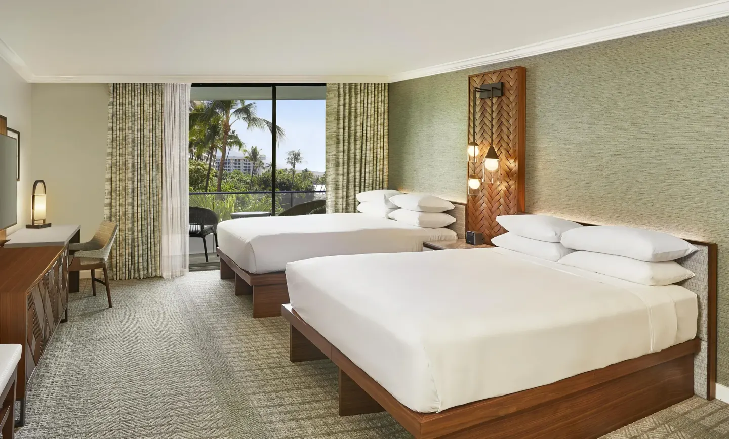 Two-bed guest room with palms outside the balcony at Hyatt Regency Maui Resort & Spa.