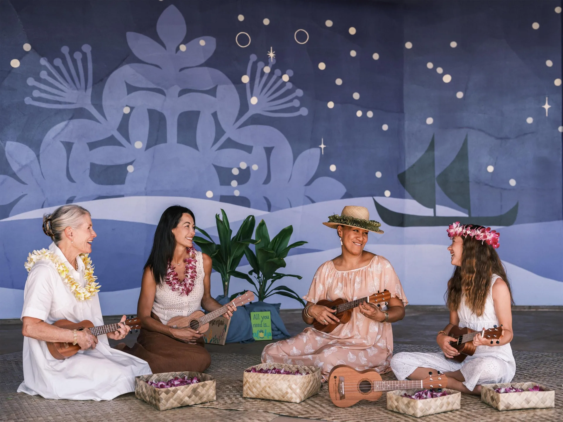 Guests play ukuleles during a cultural activity at Hyatt Regency Maui Resort & Spa.