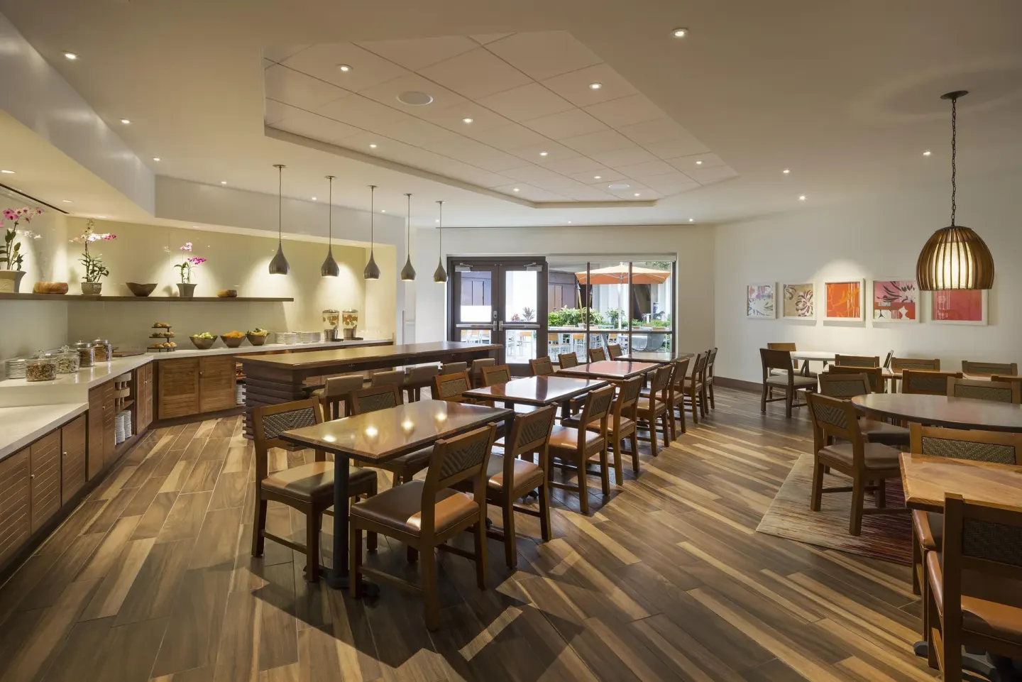 Dining room with buffet counter and tables at Hyatt Regency Maui Resort & Spa.