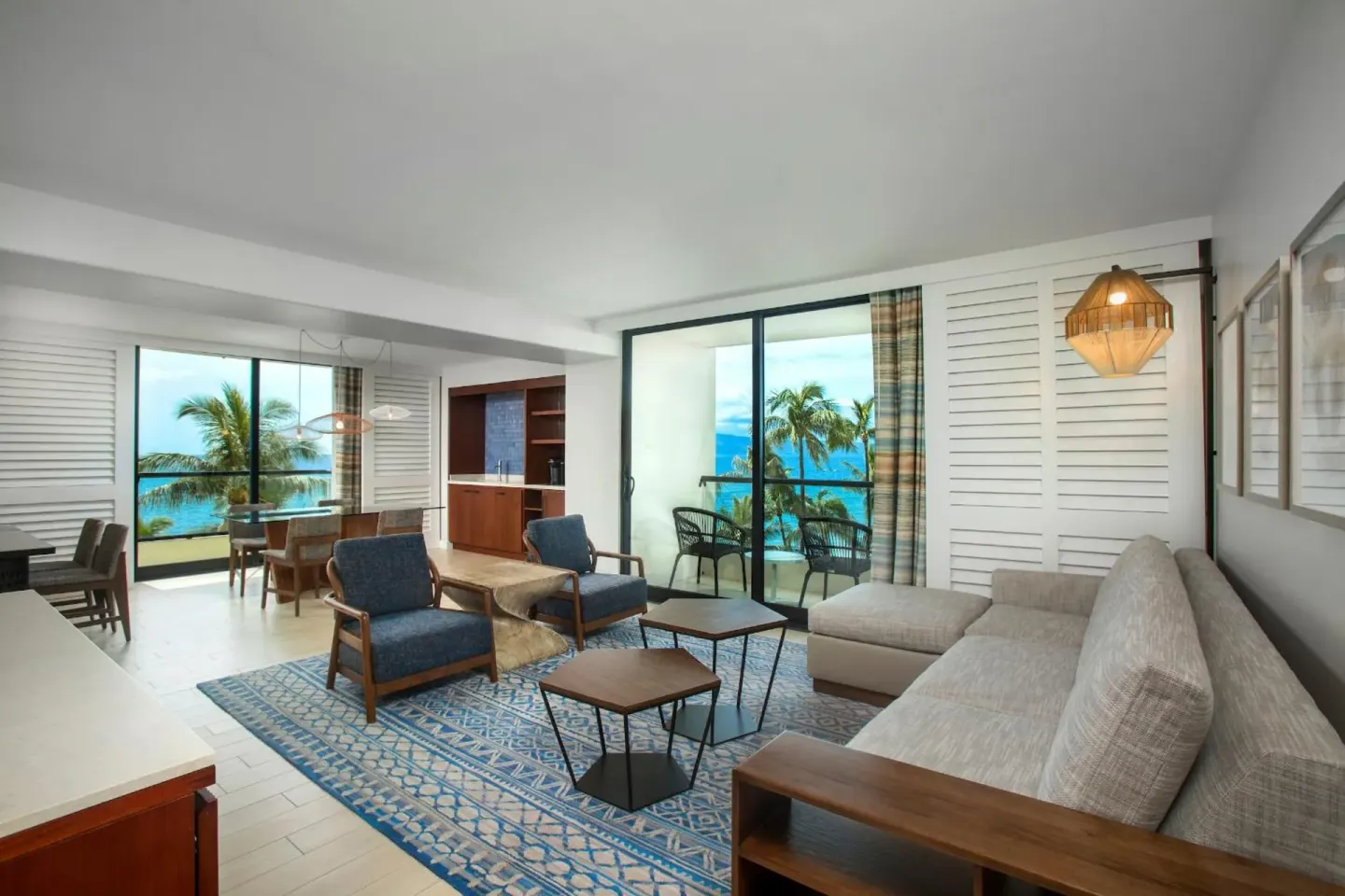 Deluxe Suite ocean living and dining area with balconies at Hyatt Regency Maui Resort & Spa.