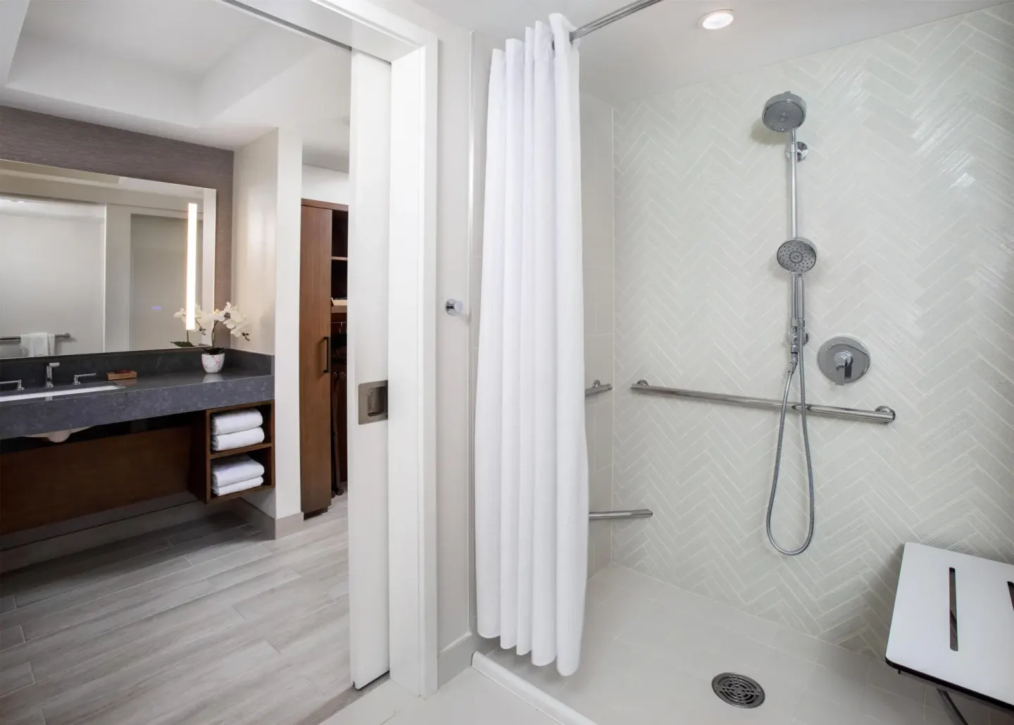 Accessible shower and vanity in a guest room at Hyatt Regency Maui Resort & Spa.