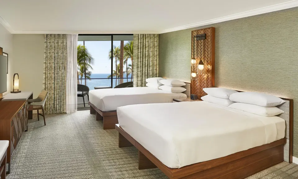 Oceanfront room with two beds and balcony view at Hyatt Regency Maui Resort & Spa.