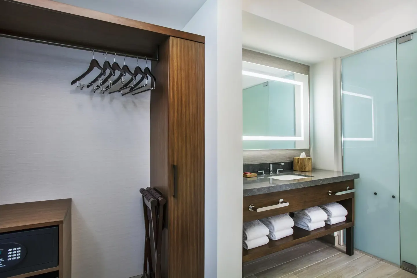 Closet and bathroom vanity in a corner room at Hyatt Regency Maui Resort & Spa.