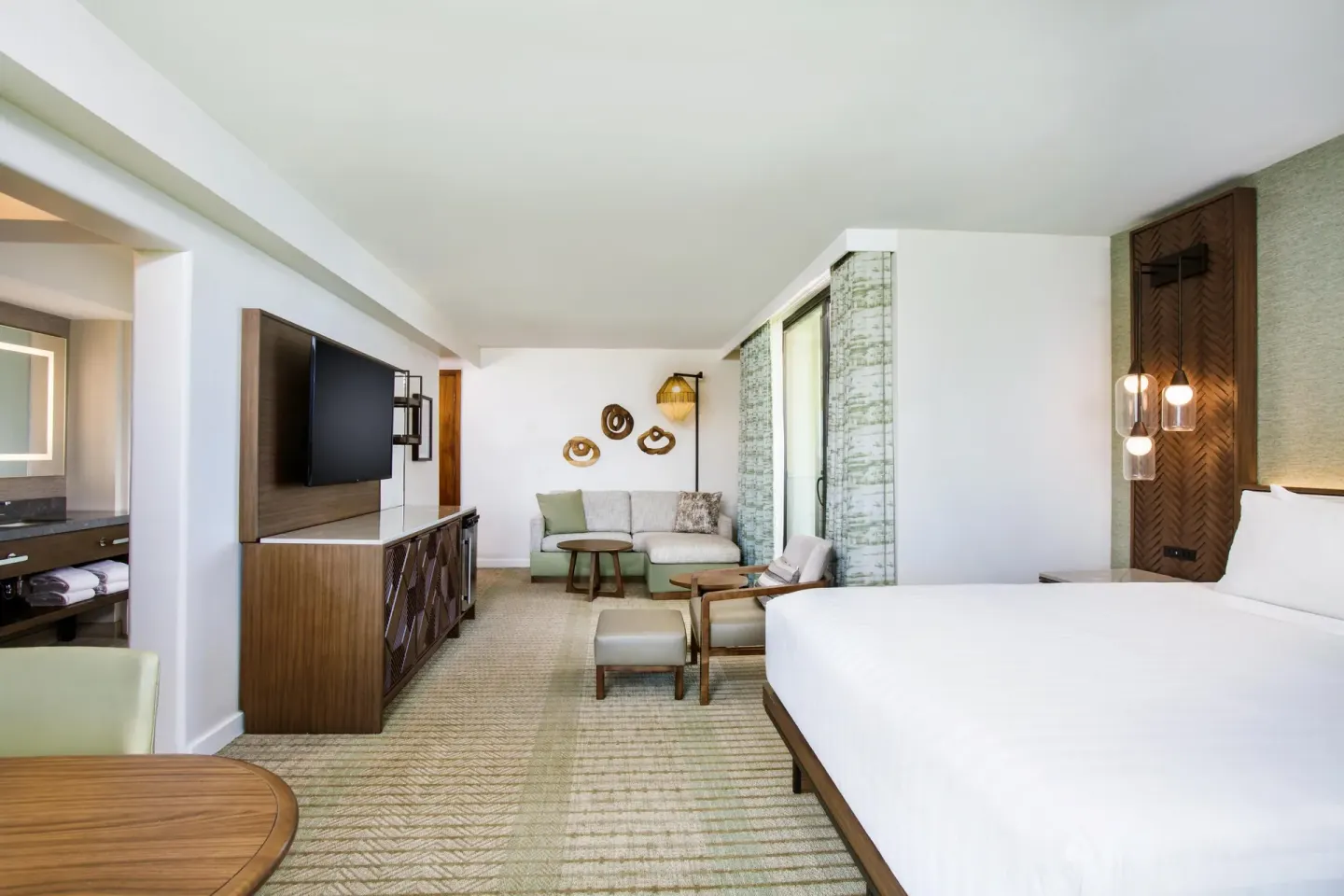 Corner ocean view room with king bed and sofa bed at Hyatt Regency Maui Resort & Spa.