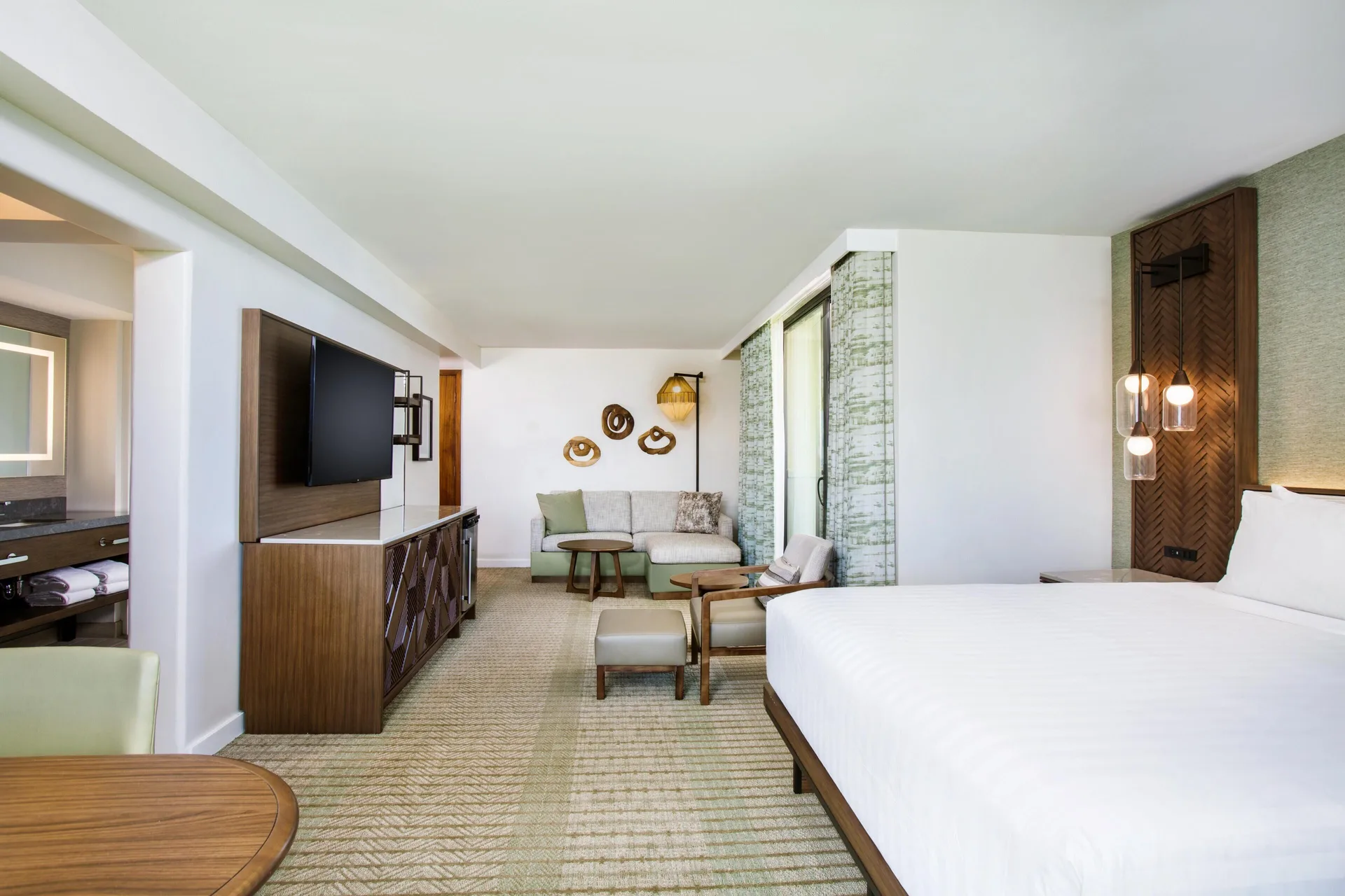 Corner ocean view room with king bed and sofa bed at Hyatt Regency Maui Resort & Spa.