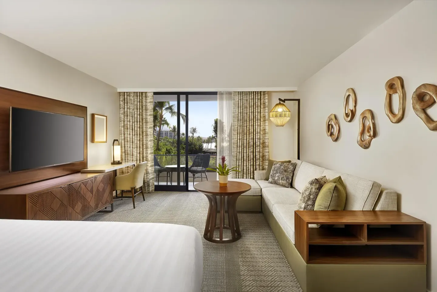 Room with sofa bed and balcony view at Hyatt Regency Maui Resort & Spa.