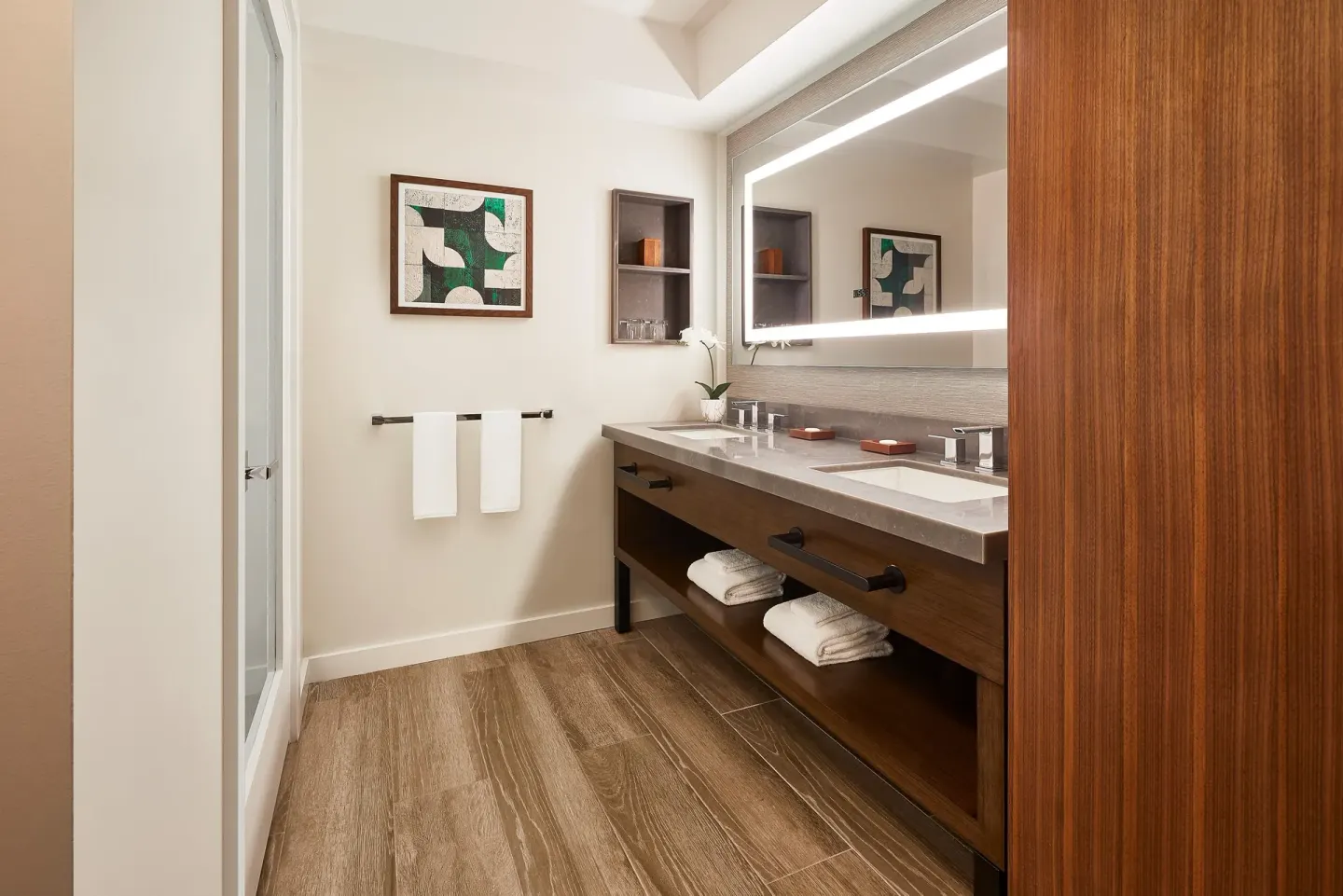 Guest room bathroom vanity and shower at Hyatt Regency Maui Resort & Spa.