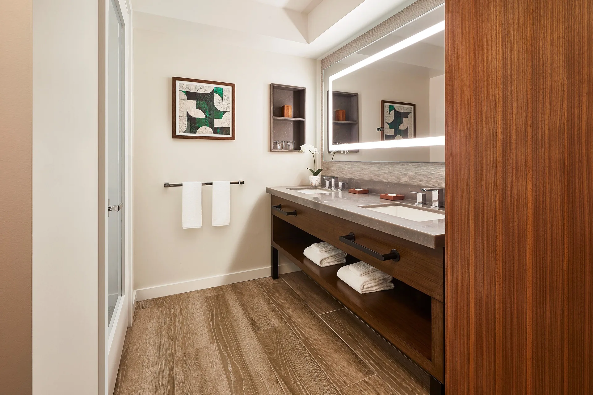 Guest room bathroom vanity and shower at Hyatt Regency Maui Resort & Spa.