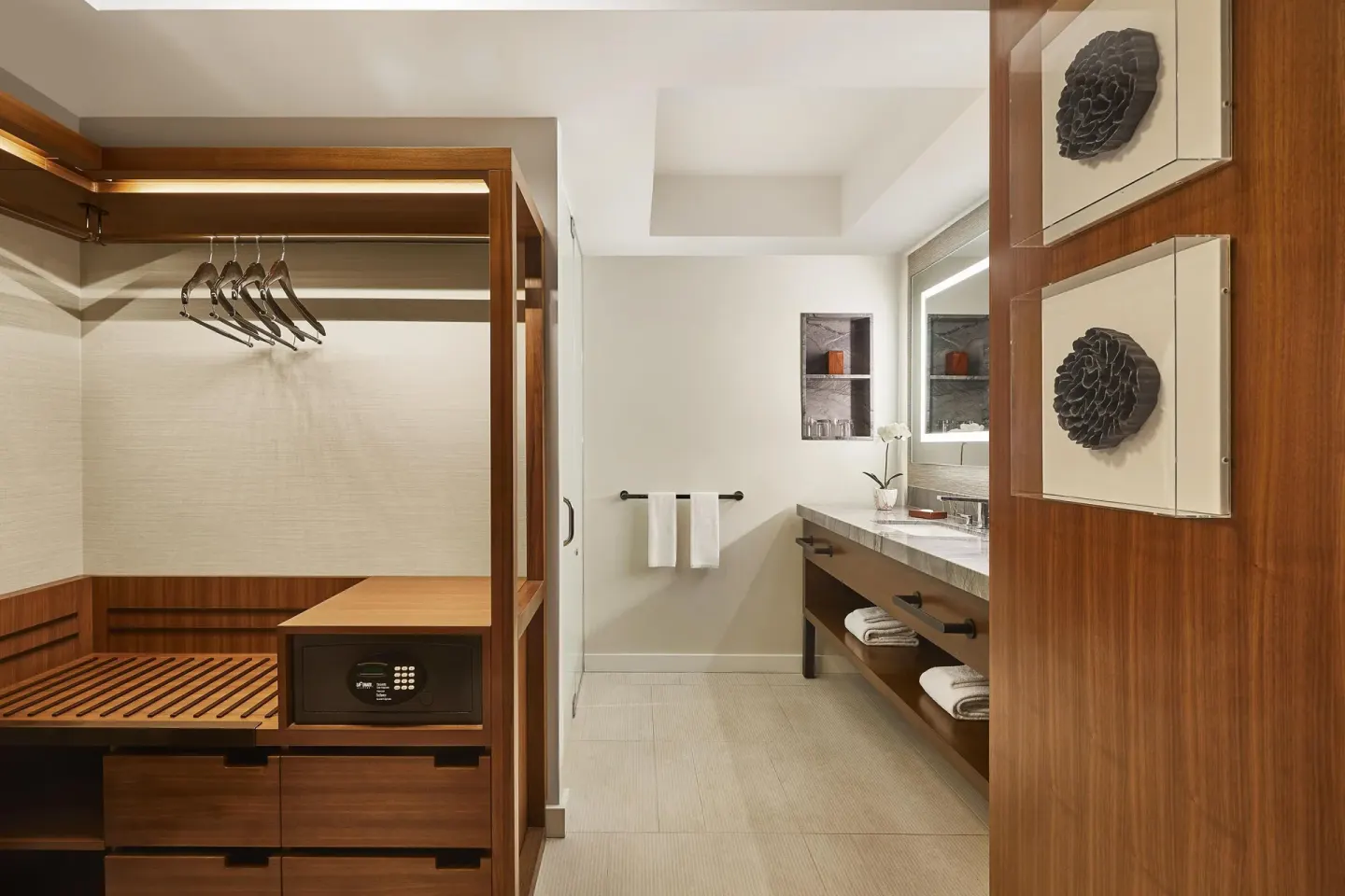 Guest room closet and bathroom vanity at Hyatt Regency Maui Resort & Spa.