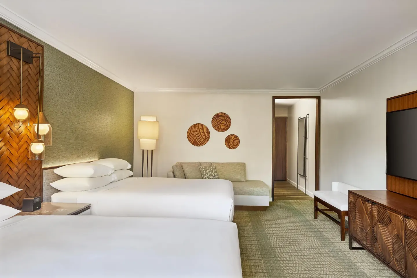 Guest room with two beds, sofa, and TV at Hyatt Regency Maui Resort & Spa.