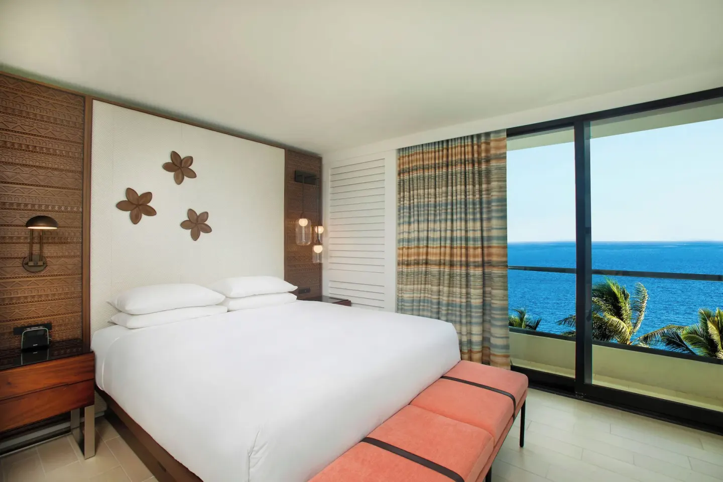 Oceanfront suite bedroom with king bed and ocean view at Hyatt Regency Maui Resort & Spa.