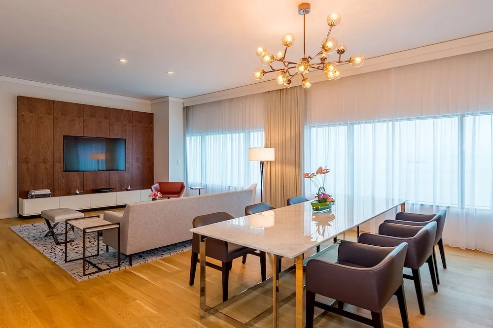 Suite dining and living area with large windows at Hyatt Regency Trinidad.