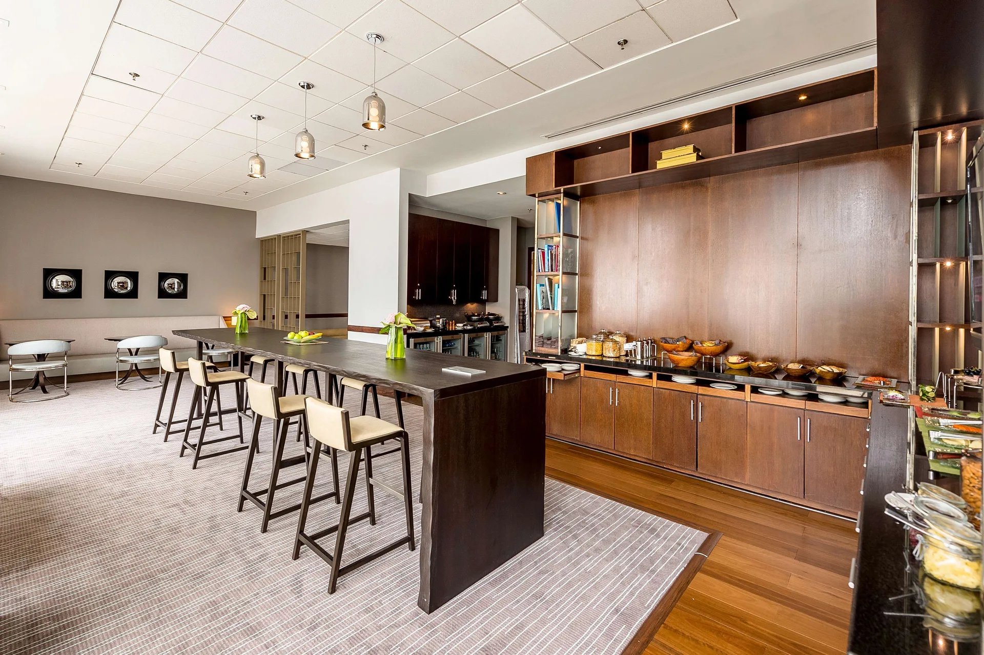 Buffet counter and high table seating in a lounge at Hyatt Regency Trinidad.