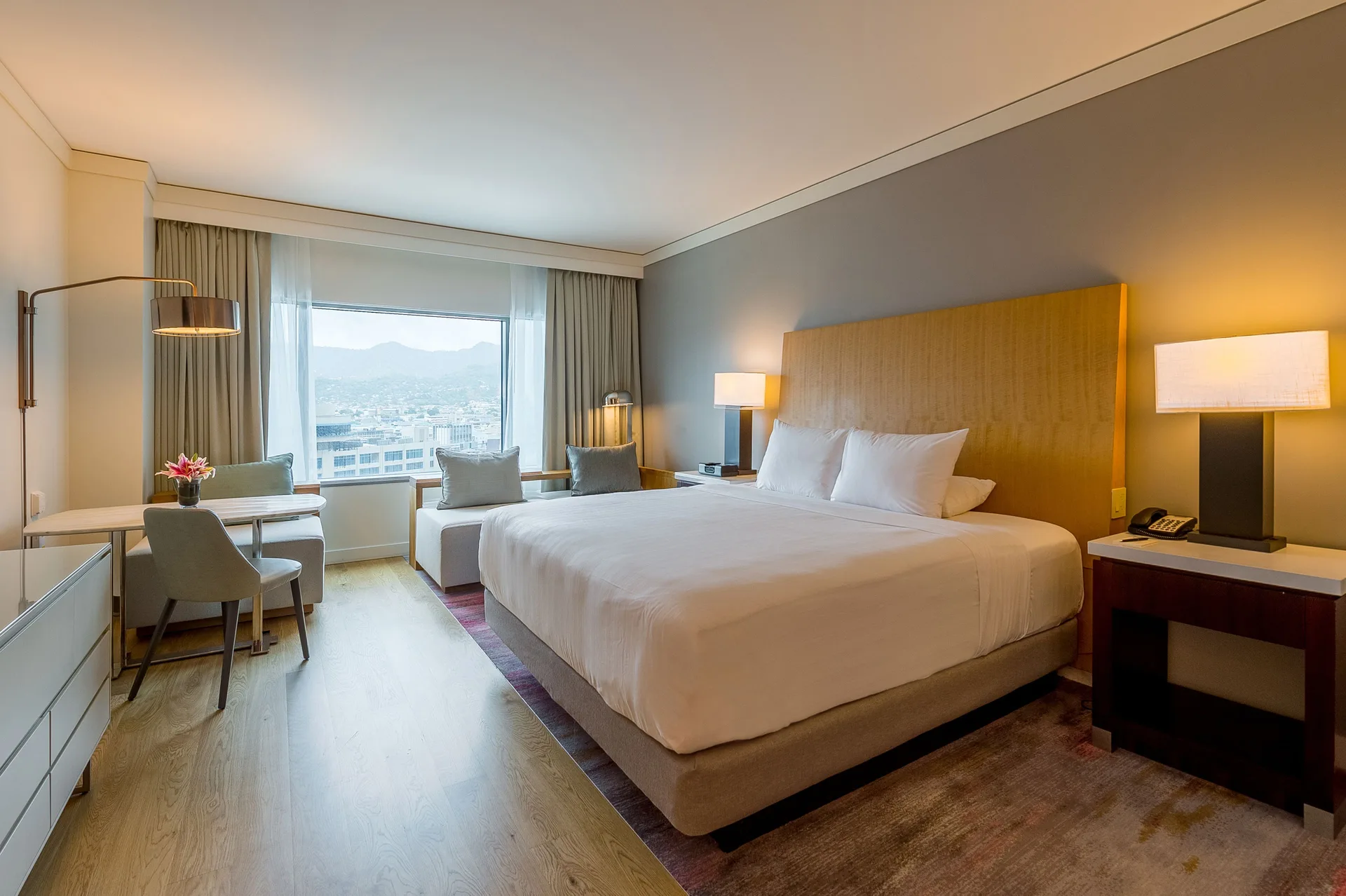 King bed guest room with city and mountain view at Hyatt Regency Trinidad.
