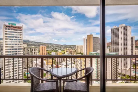 Balcony seating with Waikiki city view at Hyatt Regency Waikiki Beach Resort & Spa.