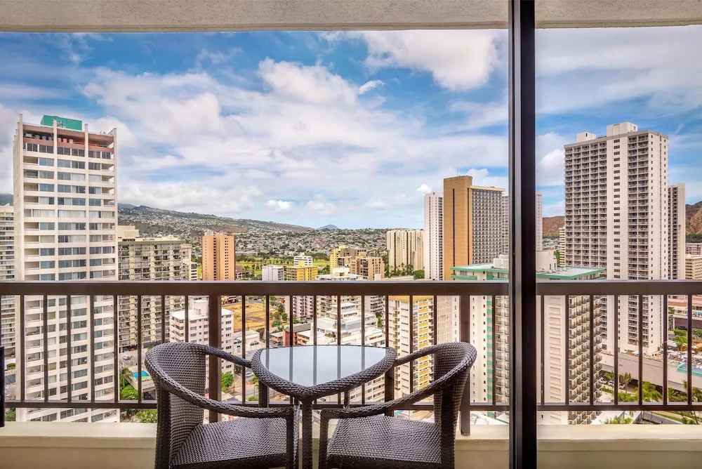 Balcony seating with Waikiki city view at Hyatt Regency Waikiki Beach Resort & Spa.