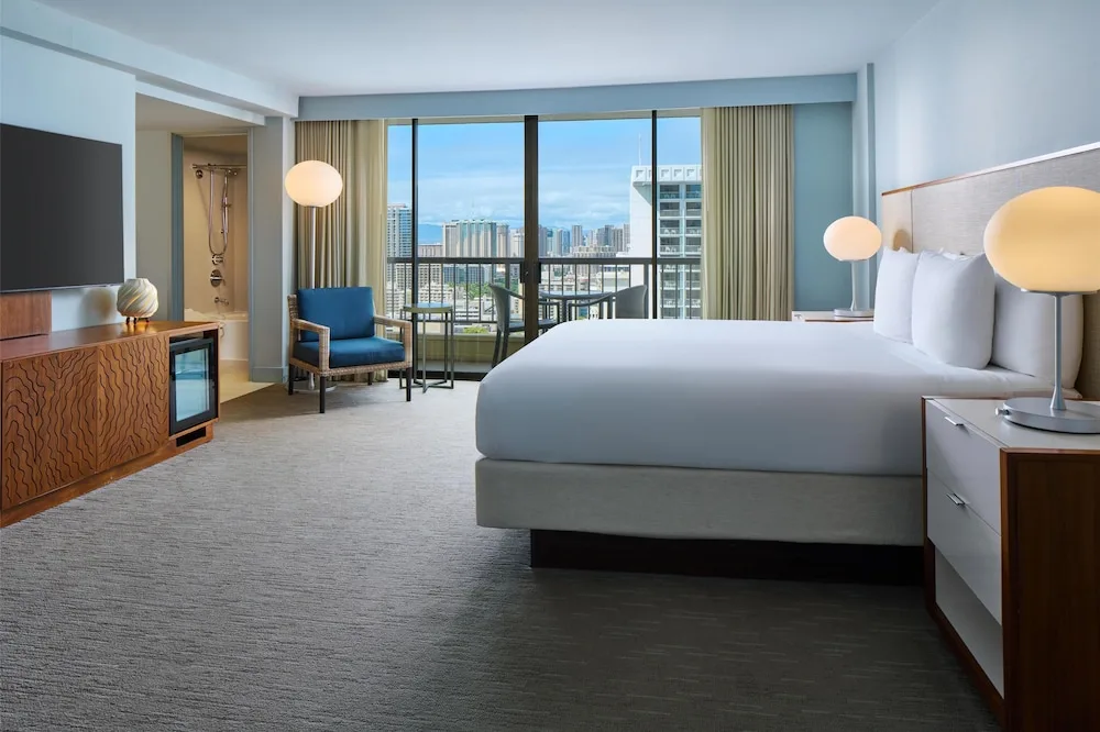 City-view king guest room with balcony at Hyatt Regency Waikiki Beach Resort & Spa.
