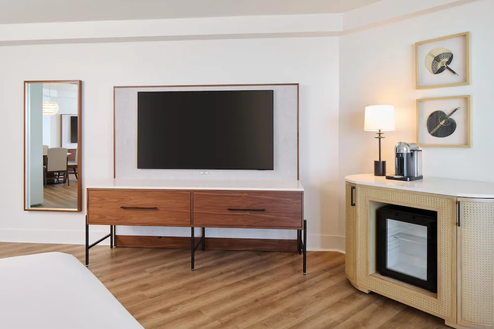 Guest room media wall and beverage cabinet at Hyatt Regency Waikiki Beach Resort & Spa.