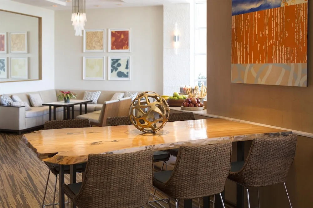 Lounge seating and communal table at Hyatt Regency Waikiki Beach Resort & Spa.