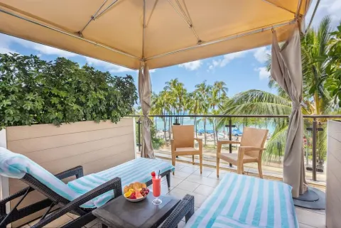 Poolside cabana with ocean view at Hyatt Regency Waikiki Beach Resort & Spa.