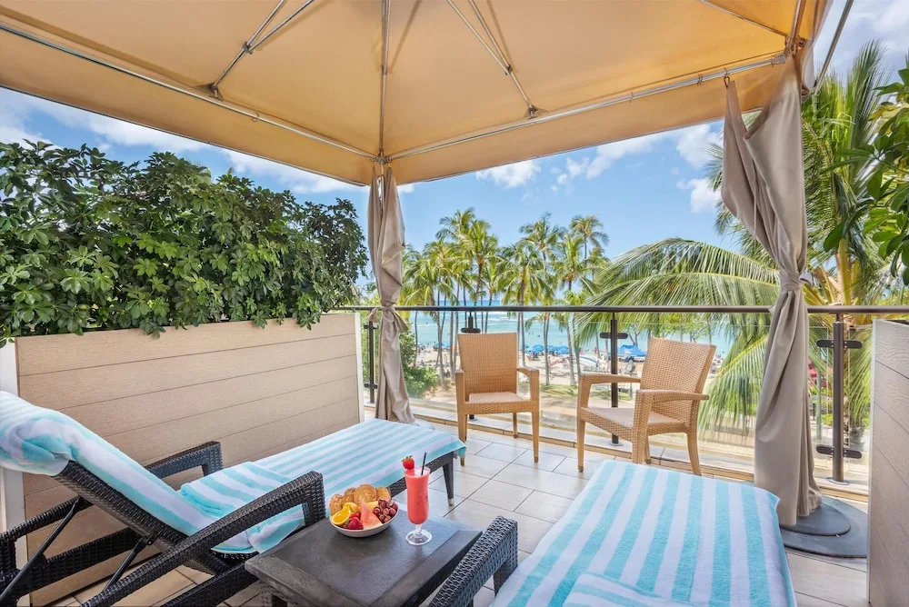 Poolside cabana with ocean view at Hyatt Regency Waikiki Beach Resort & Spa.