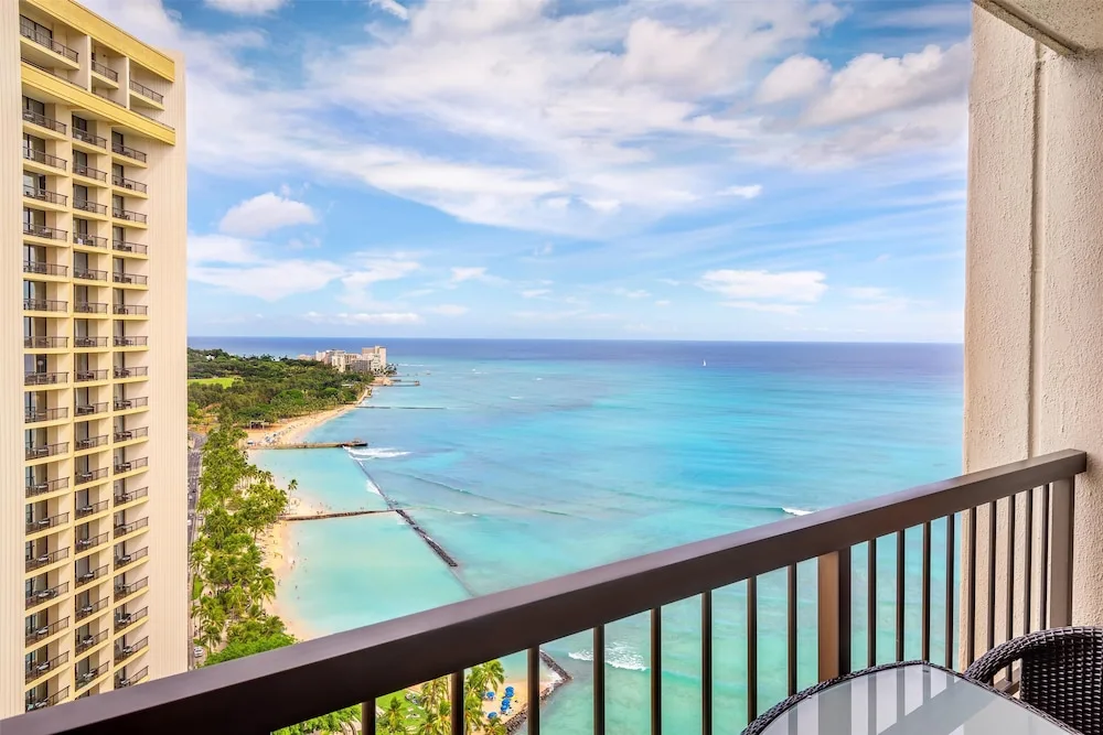Balcony view of Waikiki Beach and turquoise ocean at Hyatt Regency Waikiki Beach Resort & Spa.