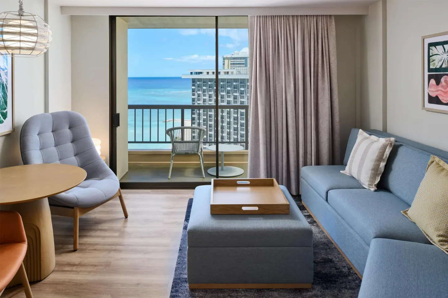 Junior Suite ocean-view sitting area with sofa bed at Hyatt Regency Waikiki Beach Resort & Spa.
