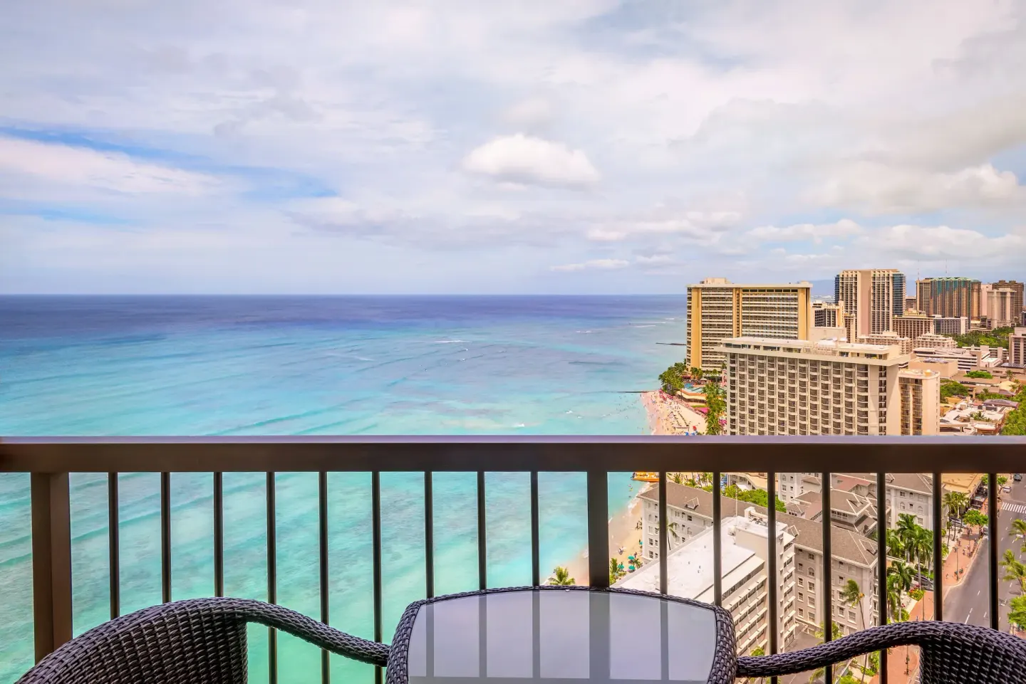 Ocean view balcony seating at Hyatt Regency Waikiki Beach Resort & Spa overlooking Waikiki Beach.