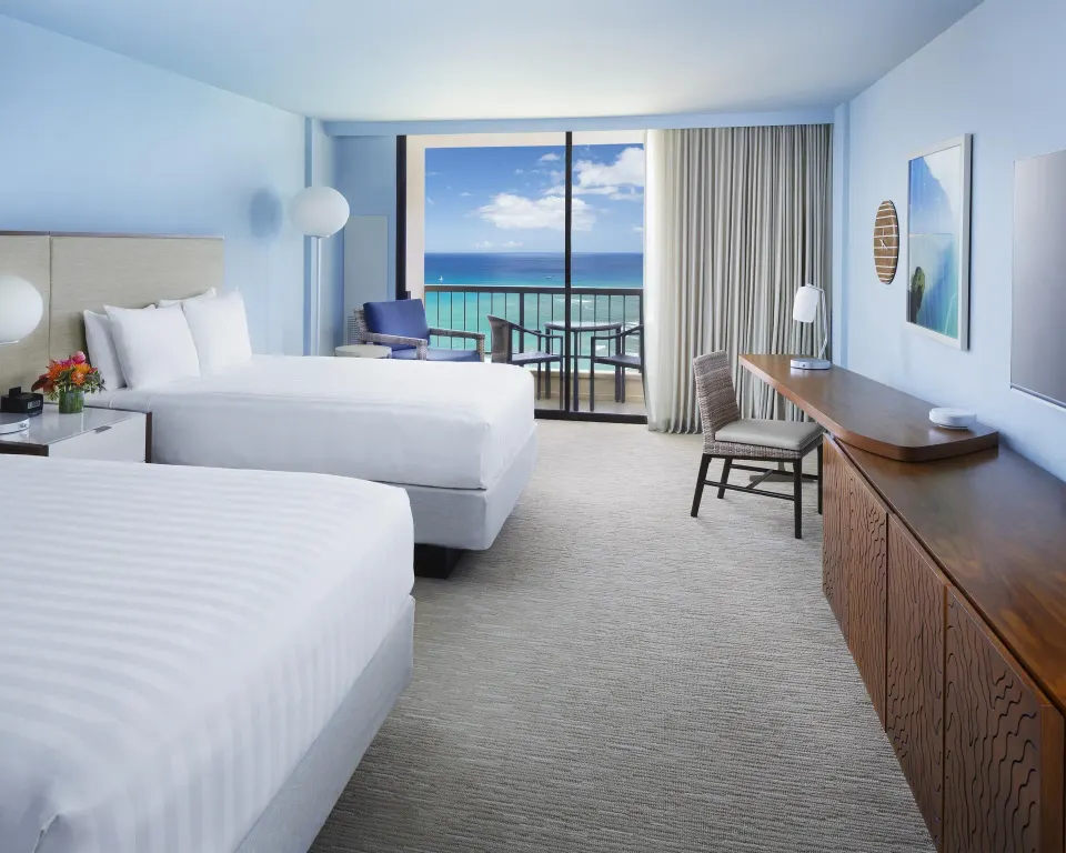 Two-bed oceanfront guest room with balcony at Hyatt Regency Waikiki Beach Resort & Spa.