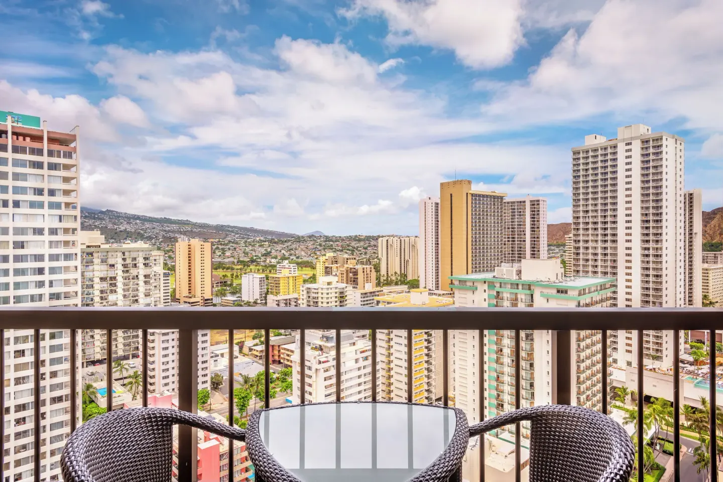 Balcony seating with Waikiki city views at Hyatt Regency Waikiki Beach Resort & Spa.