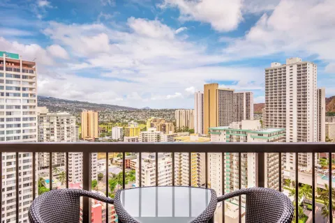 Balcony seating with Waikiki city views at Hyatt Regency Waikiki Beach Resort & Spa.