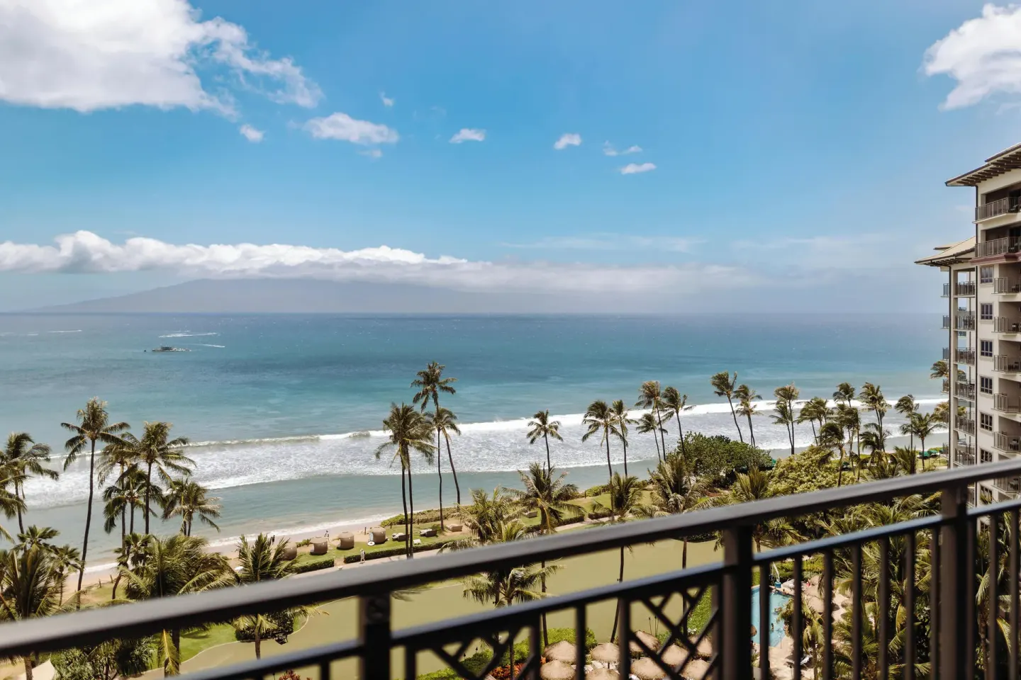 Balcony view of ocean, palms, and shoreline at Hyatt Vacation Club at Ka'anapali Beach.