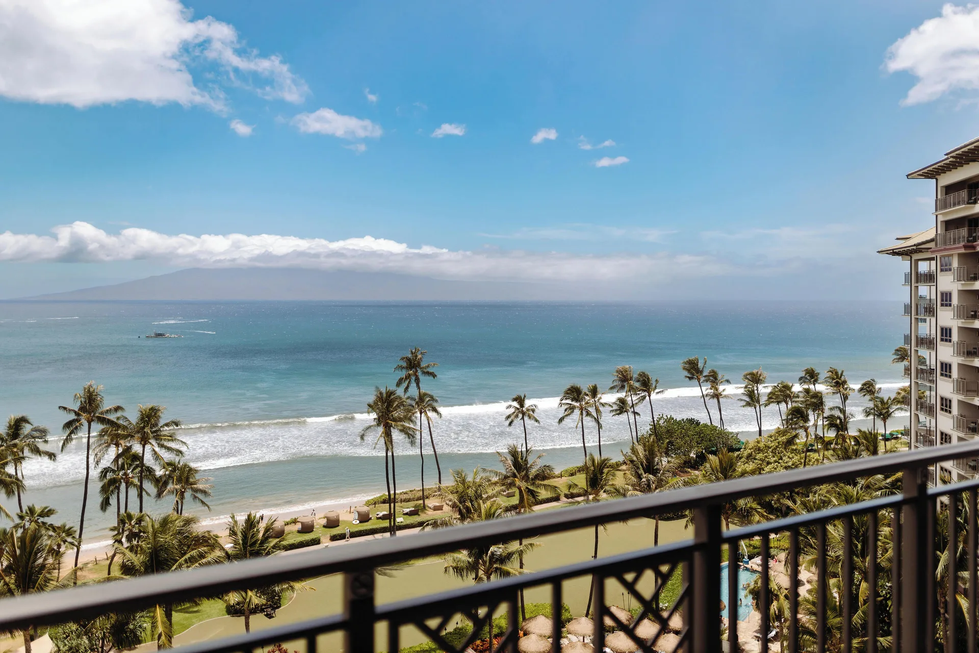 Balcony view of ocean, palms, and shoreline at Hyatt Vacation Club at Ka'anapali Beach.