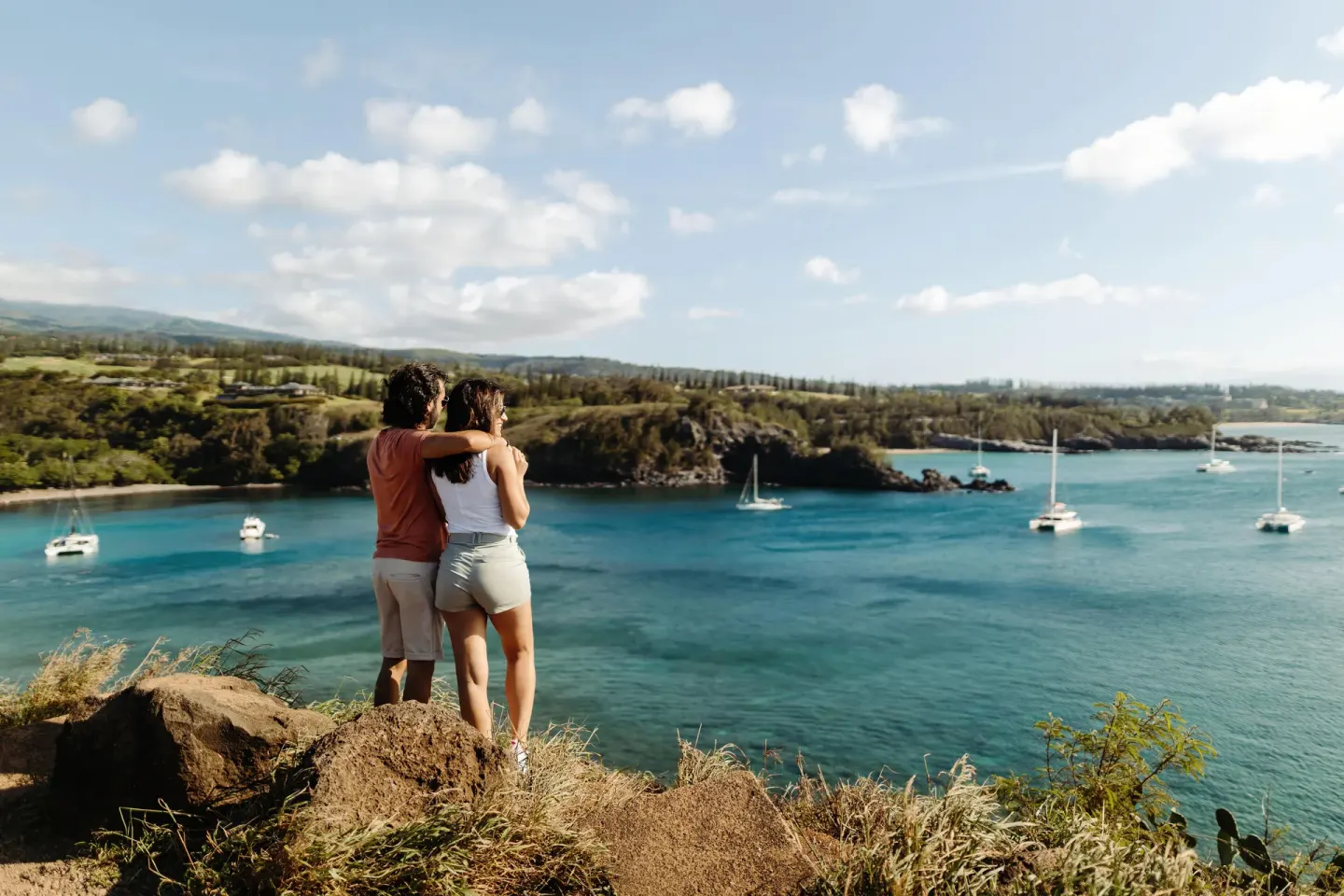 Couple overlooking a turquoise bay near Hyatt Vacation Club at Ka'anapali Beach.