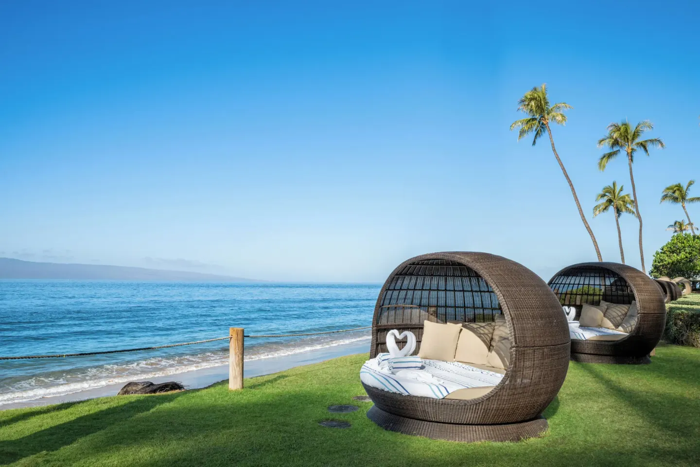 Oceanfront lawn daybeds at Hyatt Vacation Club at Ka'anapali Beach.