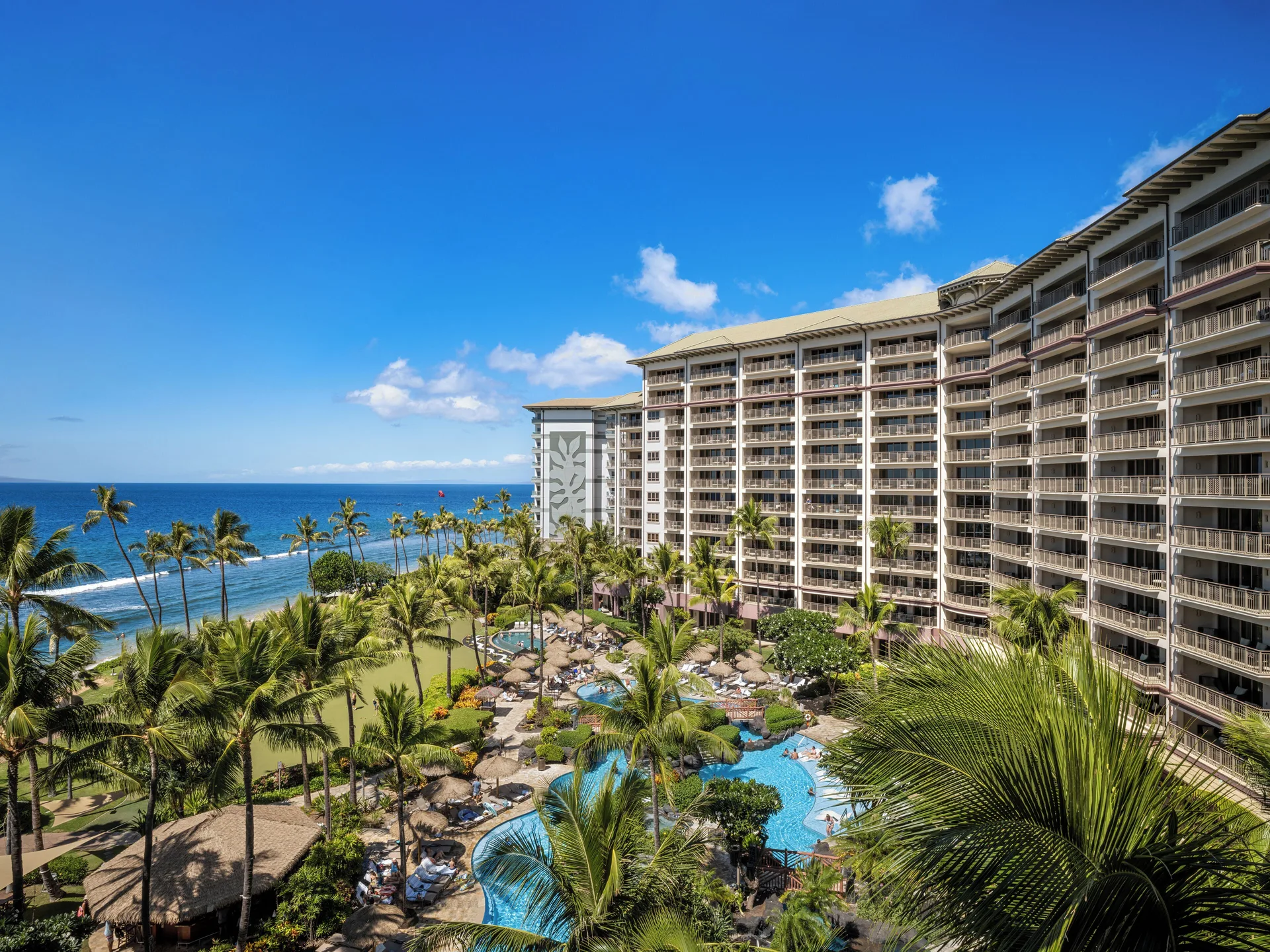 Oceanfront resort towers, pool, palms, and beach at Hyatt Vacation Club at Ka'anapali Beach.
