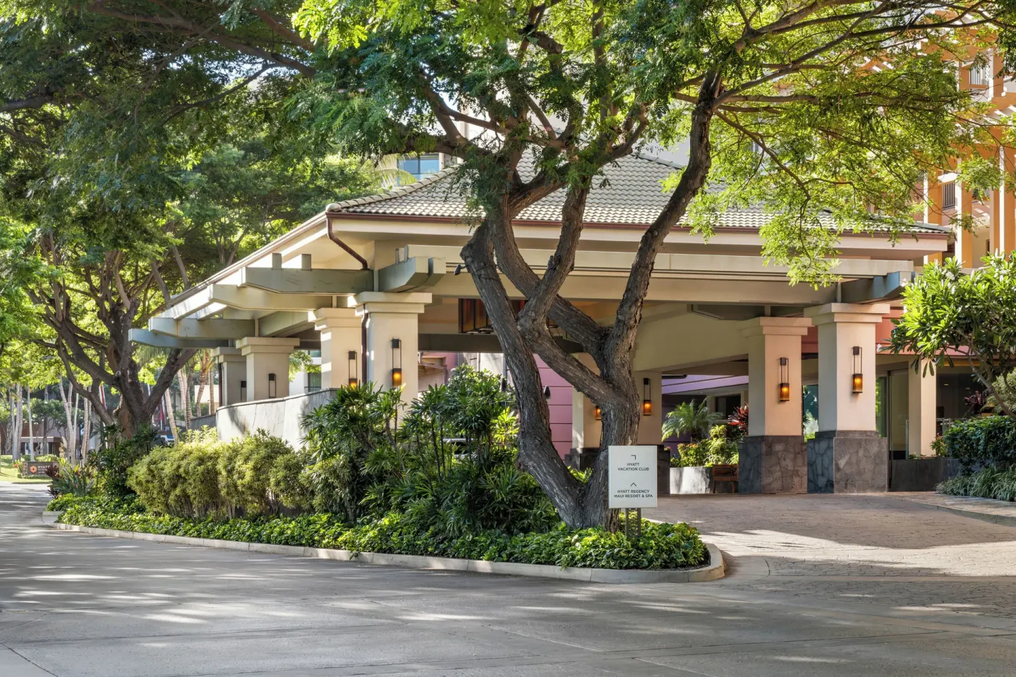 Tree-shaded entrance porte cochere at Hyatt Vacation Club at Ka'anapali Beach.