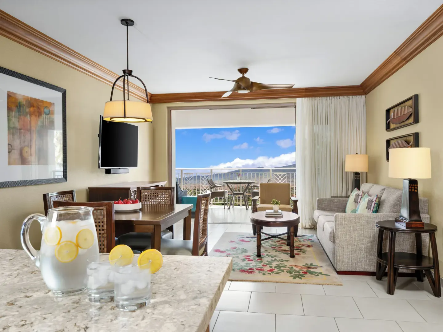 Living and dining area with balcony view at Hyatt Vacation Club at Ka'anapali Beach.