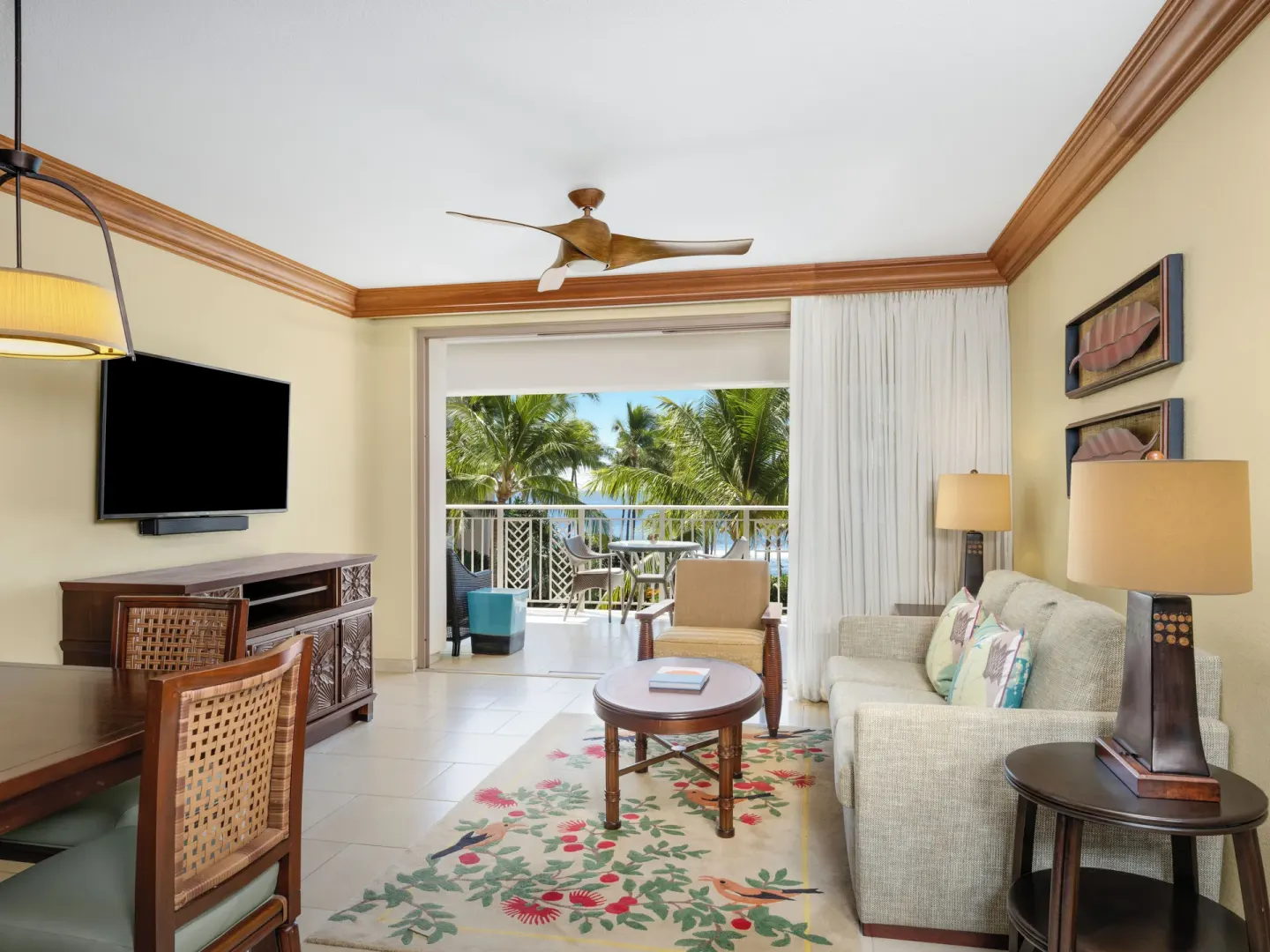 Living room with sofa and palm-framed balcony at Hyatt Vacation Club at Ka'anapali Beach.