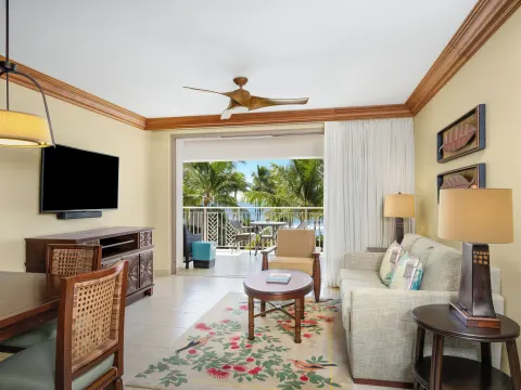 Living room with sofa and palm-framed balcony at Hyatt Vacation Club at Ka'anapali Beach.