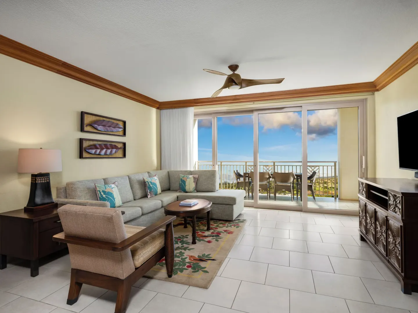 Living room with sectional sofa and balcony at Hyatt Vacation Club at Ka'anapali Beach.