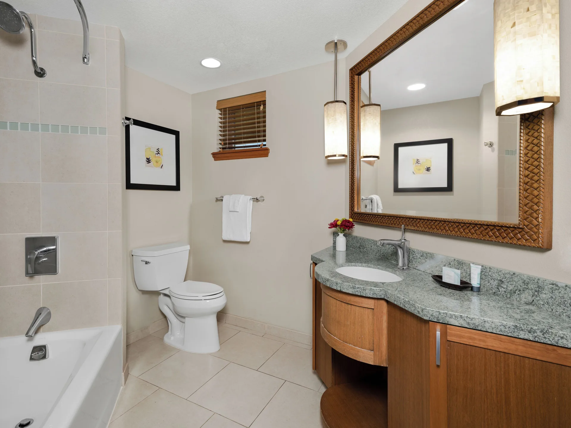 Villa bathroom with tub-shower and granite vanity at Hyatt Vacation Club at Ka'anapali Beach.