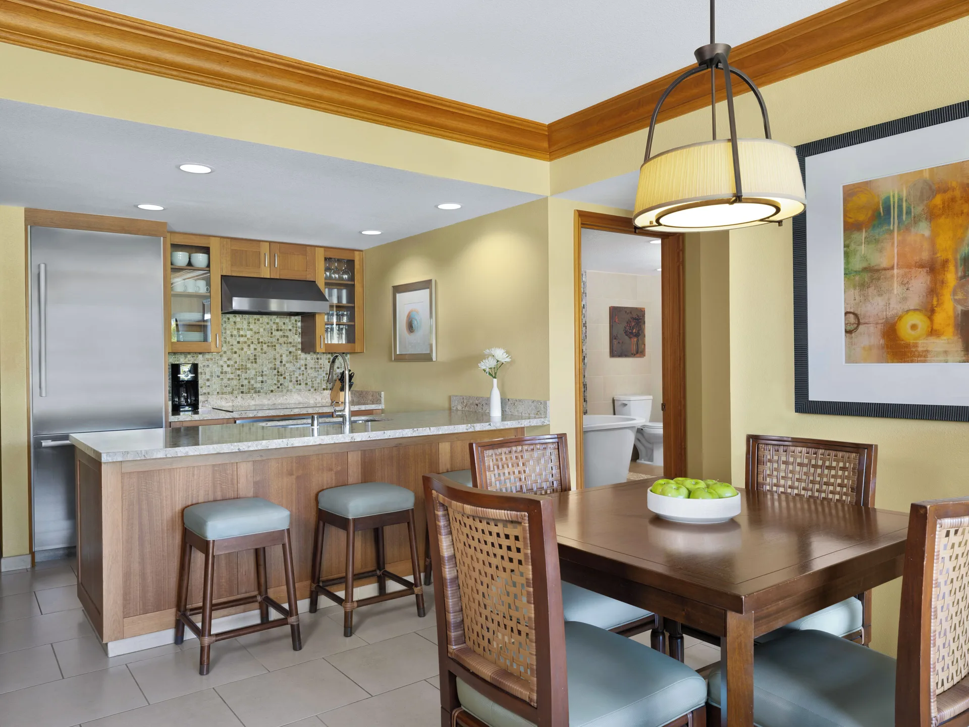 Dining area and kitchen in a villa at Hyatt Vacation Club at Ka'anapali Beach.