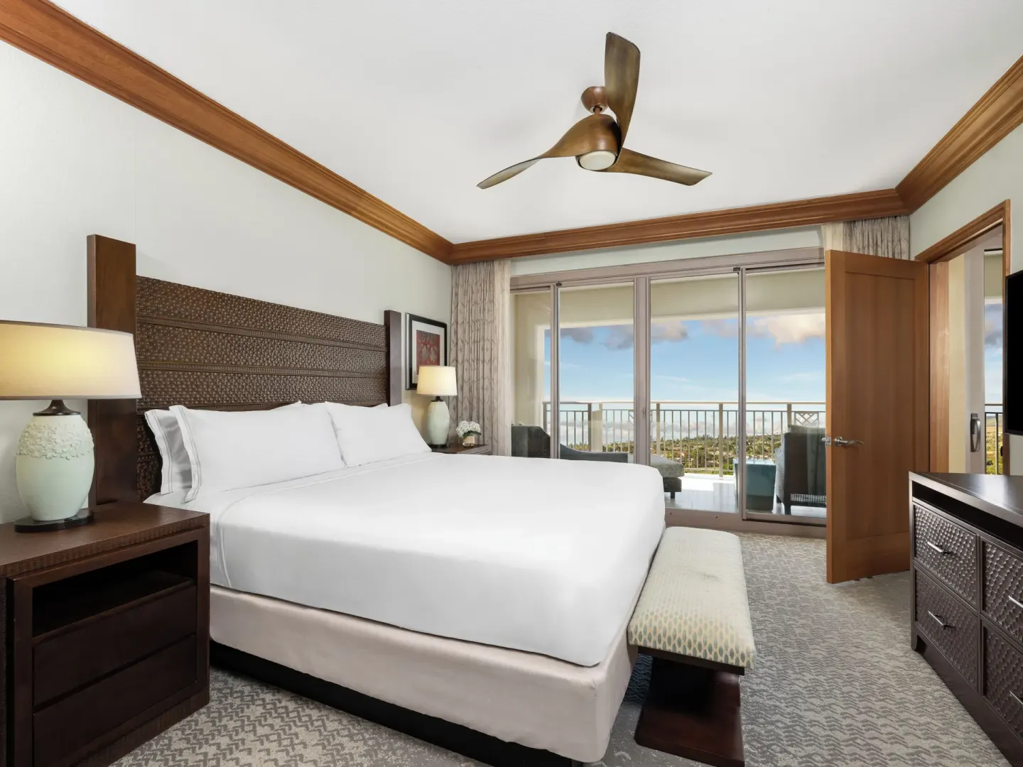King bedroom with patio doors in a villa at Hyatt Vacation Club at Ka'anapali Beach.